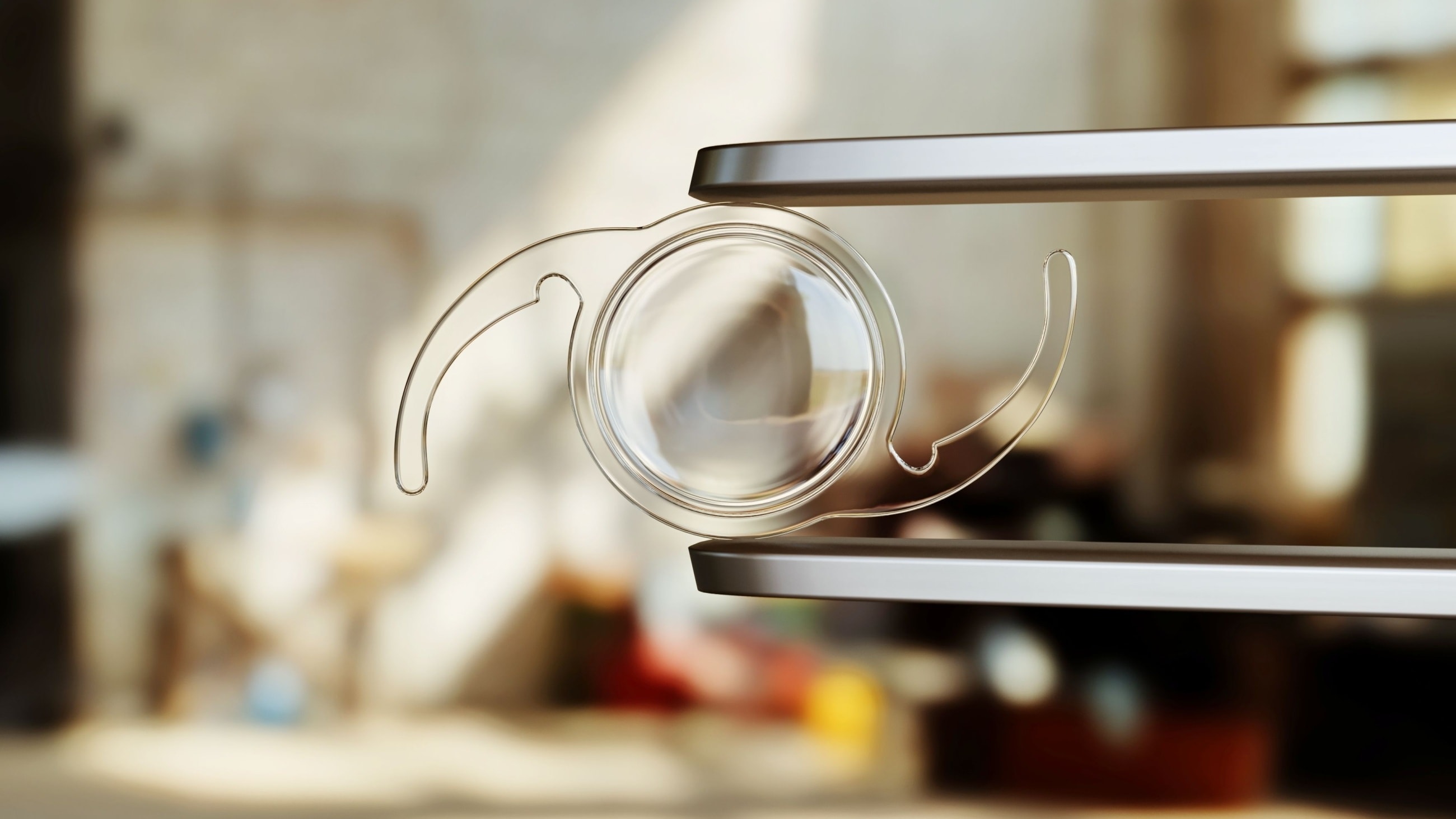 Image of a nature scene with trees and green grass through the outline of a presbyopia iol.