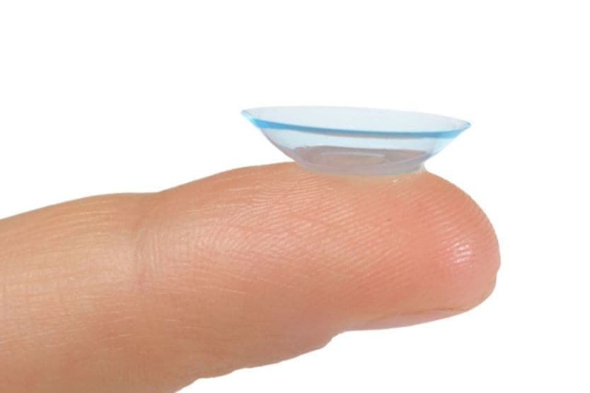 An image of an inside out contact lens, with the edges flipped out, balanced on a fingertip. An image of an inside out contact lens, with the edges flipped out, balanced on a fingertip.