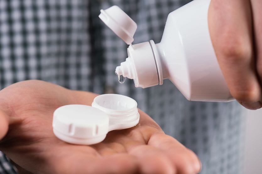 Contact lens solutions displayed on grocery store shelves
