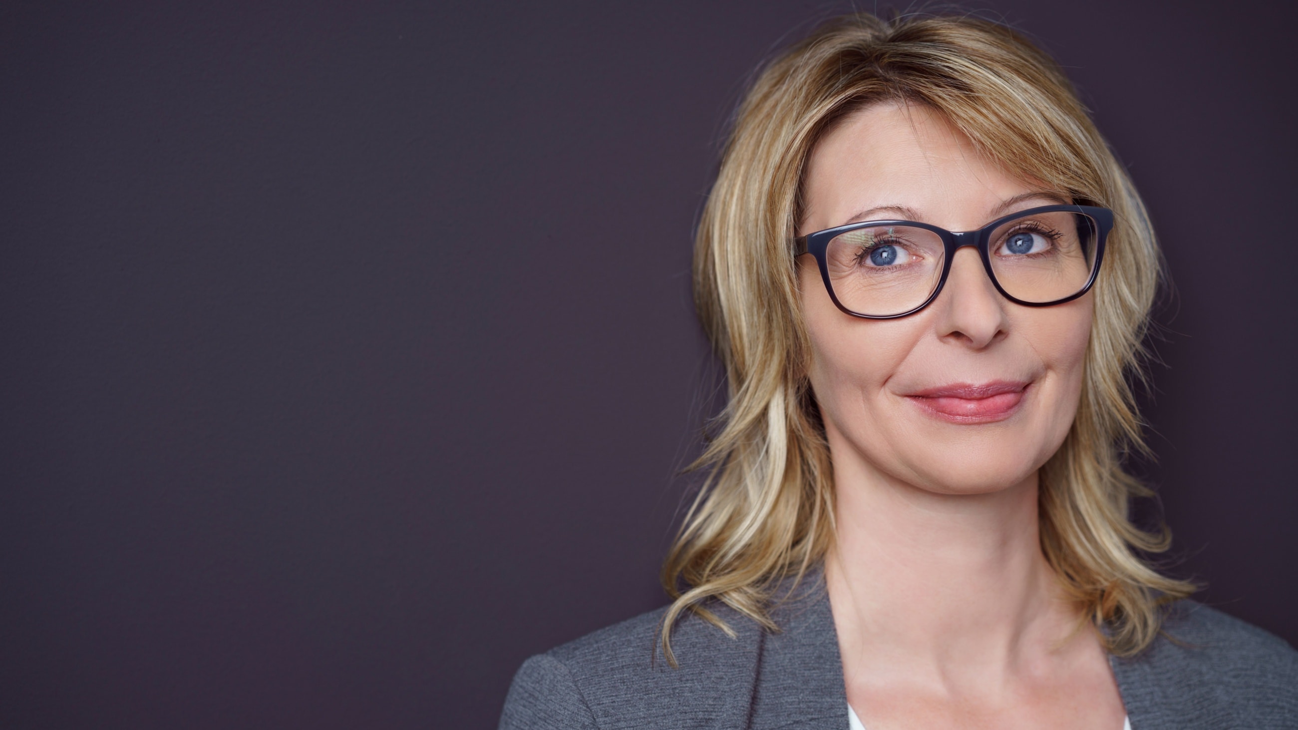 middle aged woman wearing glasses