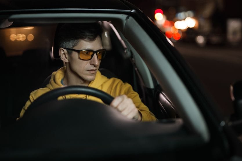 Man wearing night driving glasses while driving