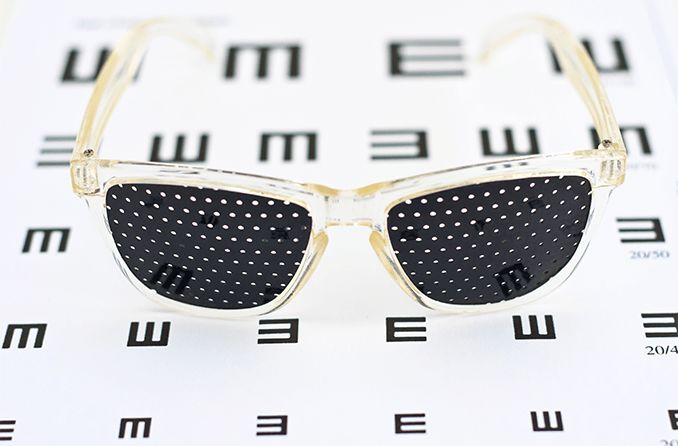 pinhole glasses on an eye chart