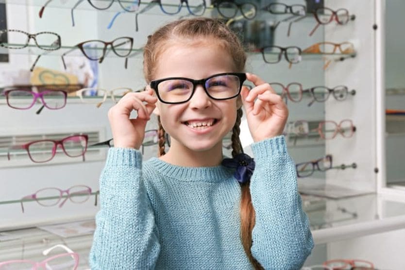 girl in glasses shop