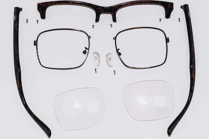 Eyeglass frame disassembled for parts.