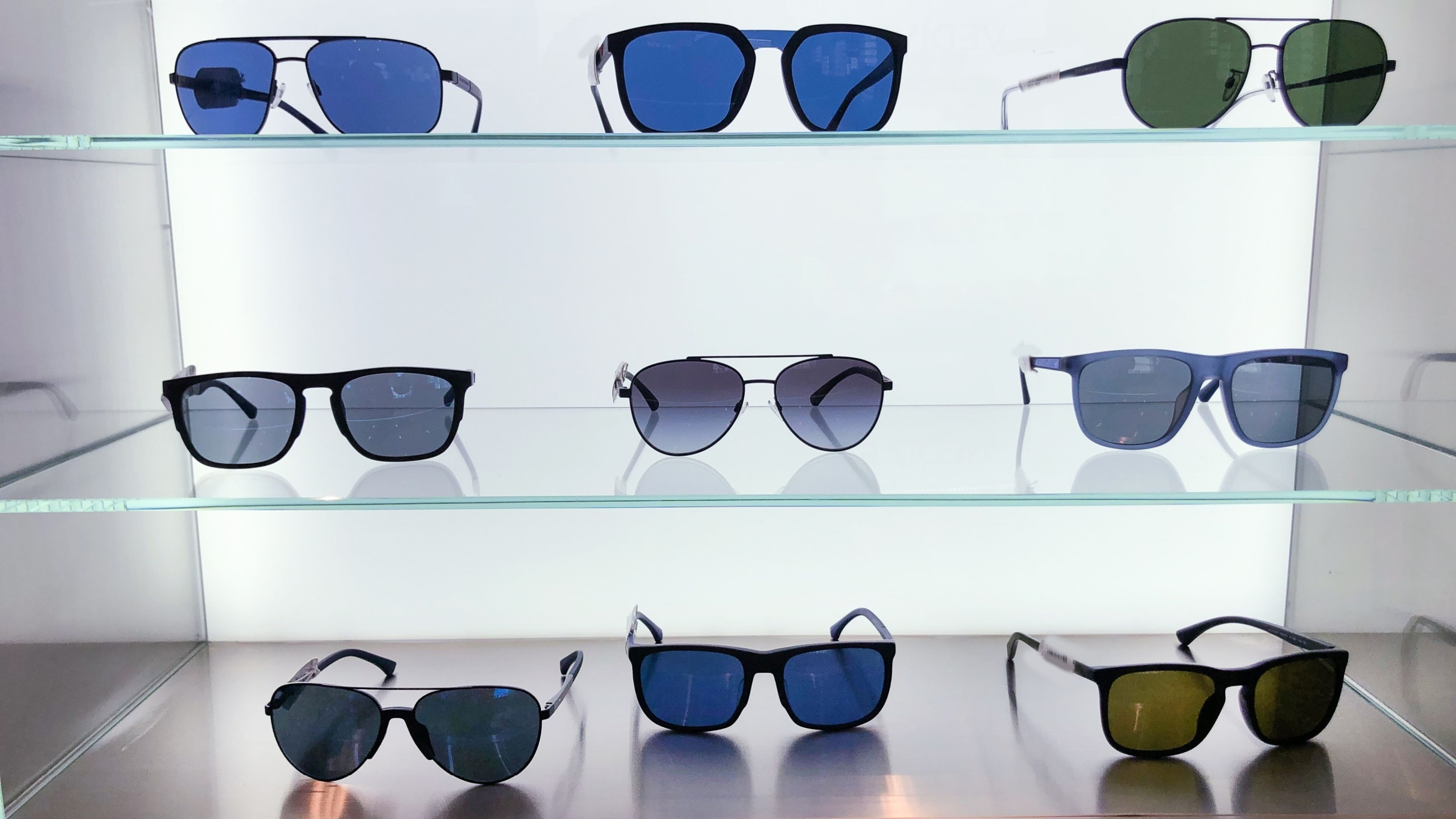 Assortment of sunglasses in a store. Assortment of sunglasses in a store.