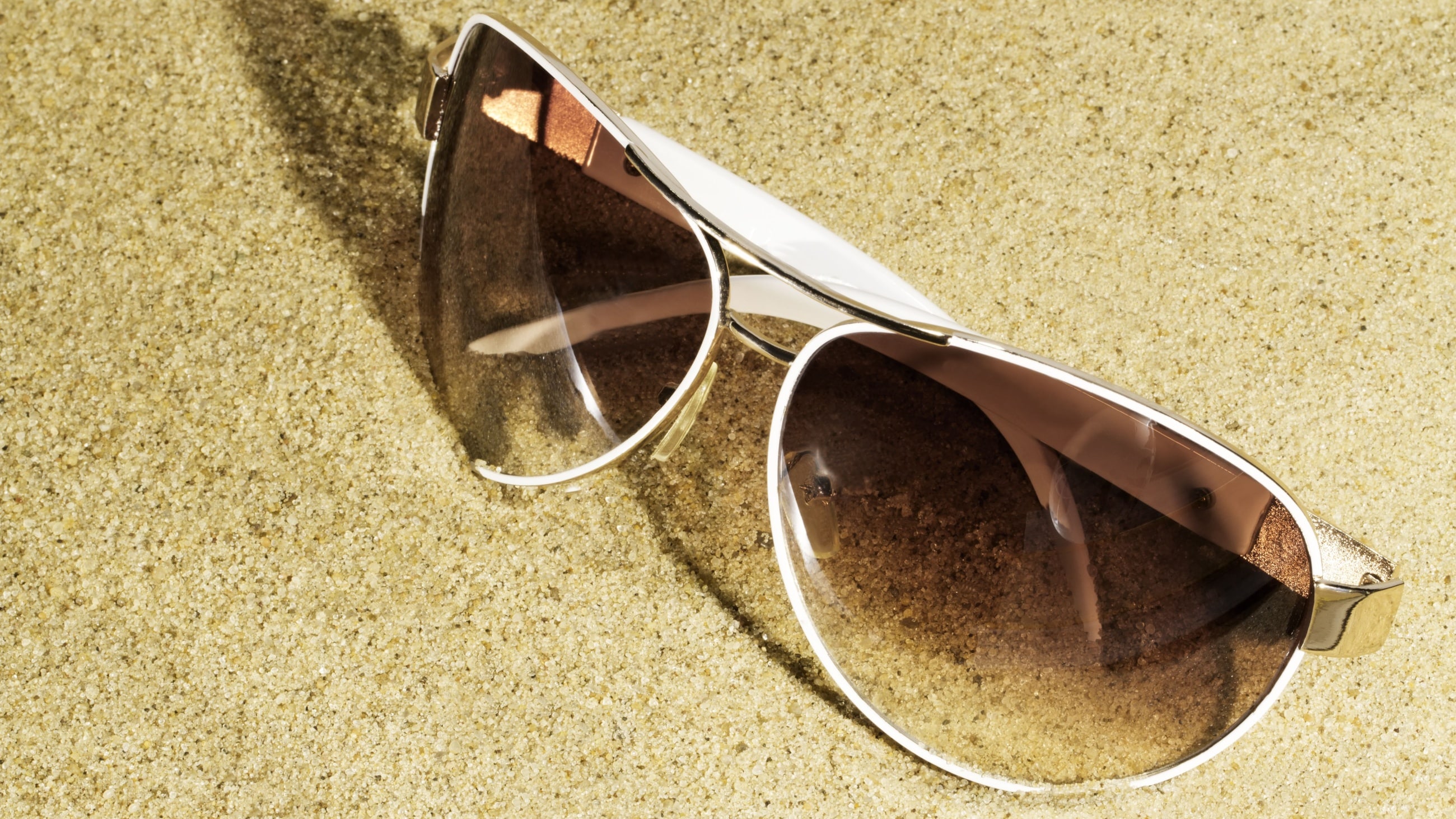 gradient sunglasses on the beach