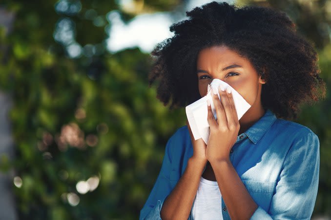 Girl with pink eyes and a cold