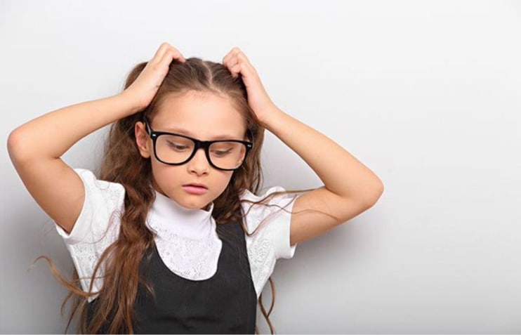 Child with headache from glasses Child with headache from glasses