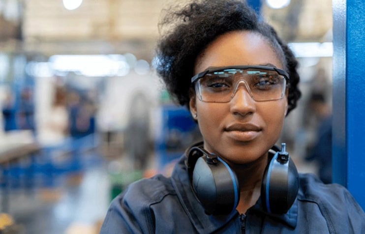 Woman wearing safety glasses Woman wearing safety glasses