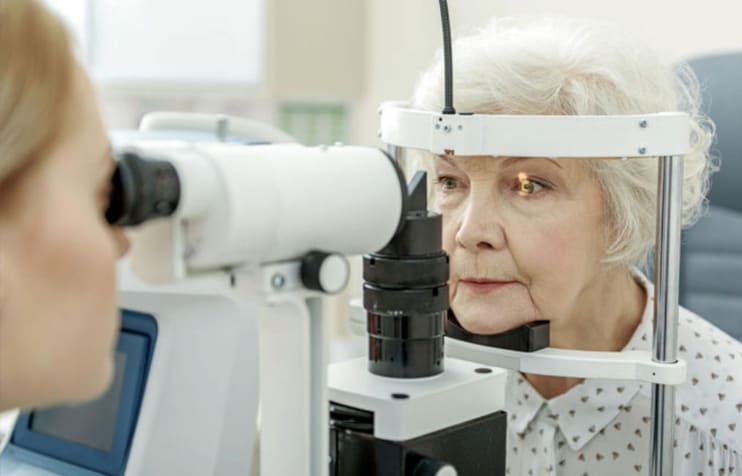 Elderly woman at an eye exam Elderly woman at an eye exam