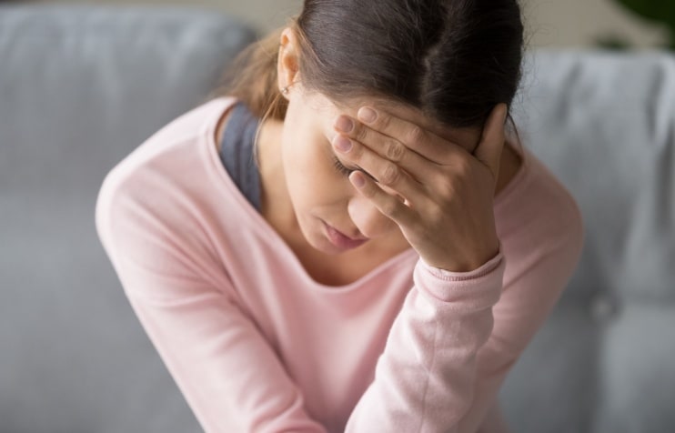 Young woman with headache