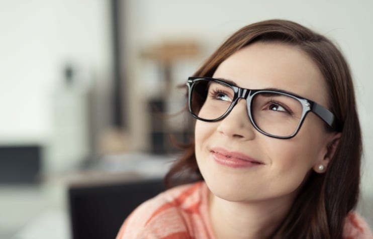 Young woman smiling wearing glasses