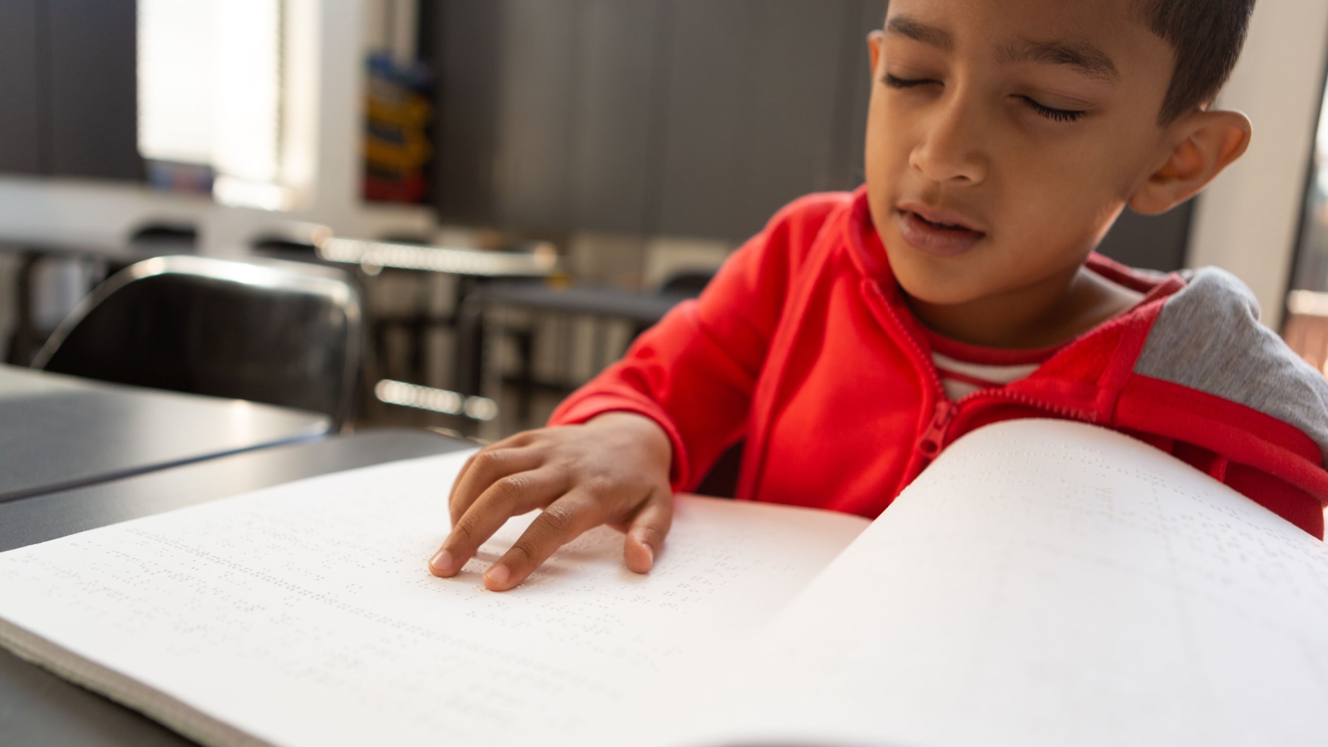 Boy reading Braille