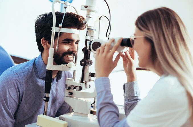 man having his eyes examined man having his eyes examined