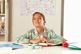 young girl outside squinting