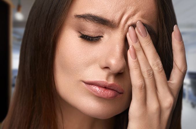 woman with eye irritation woman with eye irritation