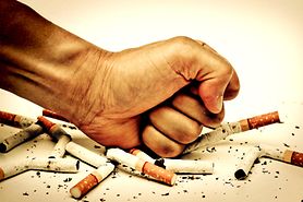 hand crushing cigarettes