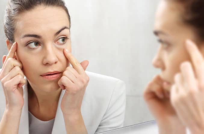 Woman with bags under eyes Woman with bags under eyes