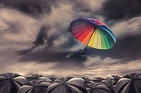 color vision displaying a rainbow umbrella against a gray backdrop