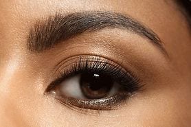 closeup of an eye with long eyelashes