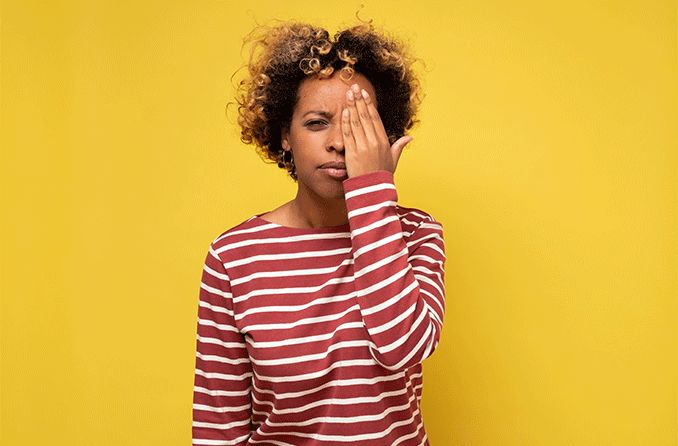 woman with monovision covering one eye woman with monovision covering one eye