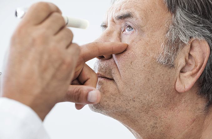 man getting eye exam checking for ocular melanosis
