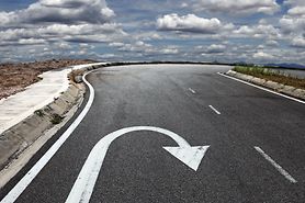 A road with a reverse arrow on it to demonstrate an analogy for whether myopia can be reversed. A road with a reverse arrow on it to demonstrate an analogy for whether myopia can be reversed.