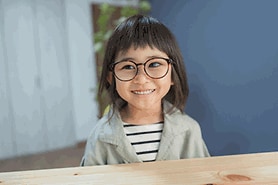 young girl wearing glasses with a lazy eye young girl wearing glasses with a lazy eye