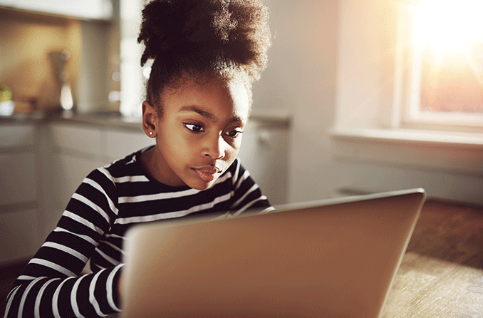 girl staring at computer screen