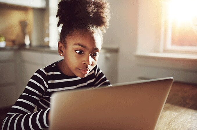girl staring at computer screen