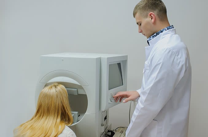 woman receiving a visual field test for ptosis