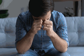 depressed man with vision loss experiencing mental health issues