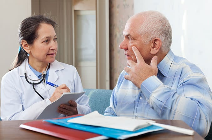 patient and eye doctor consulting on when to have cataract surgery patient and eye doctor consulting on when to have cataract surgery