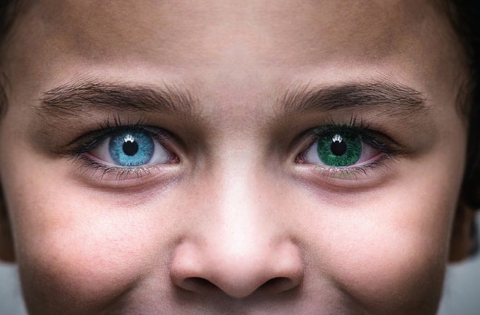 Child with heterochromia has one blue eye and one green eye Child with heterochromia has one blue eye and one green eye