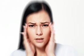 woman with blurry vision and a headache