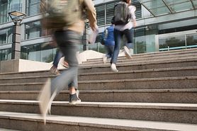 Blurry and shaky view of people walking due to the condition oscillopsia