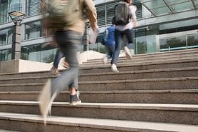 Blurry and shaky view of people walking due to the condition oscillopsia