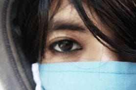 woman with covid and blurry vision