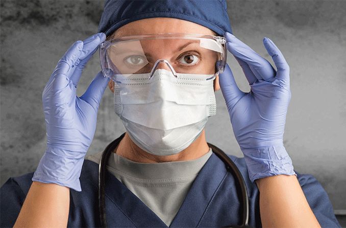 doctor wearing face mask, gloves and goggles protecting from covid doctor wearing face mask, gloves and goggles protecting from covid