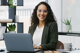 Woman wearing glasses in workplace