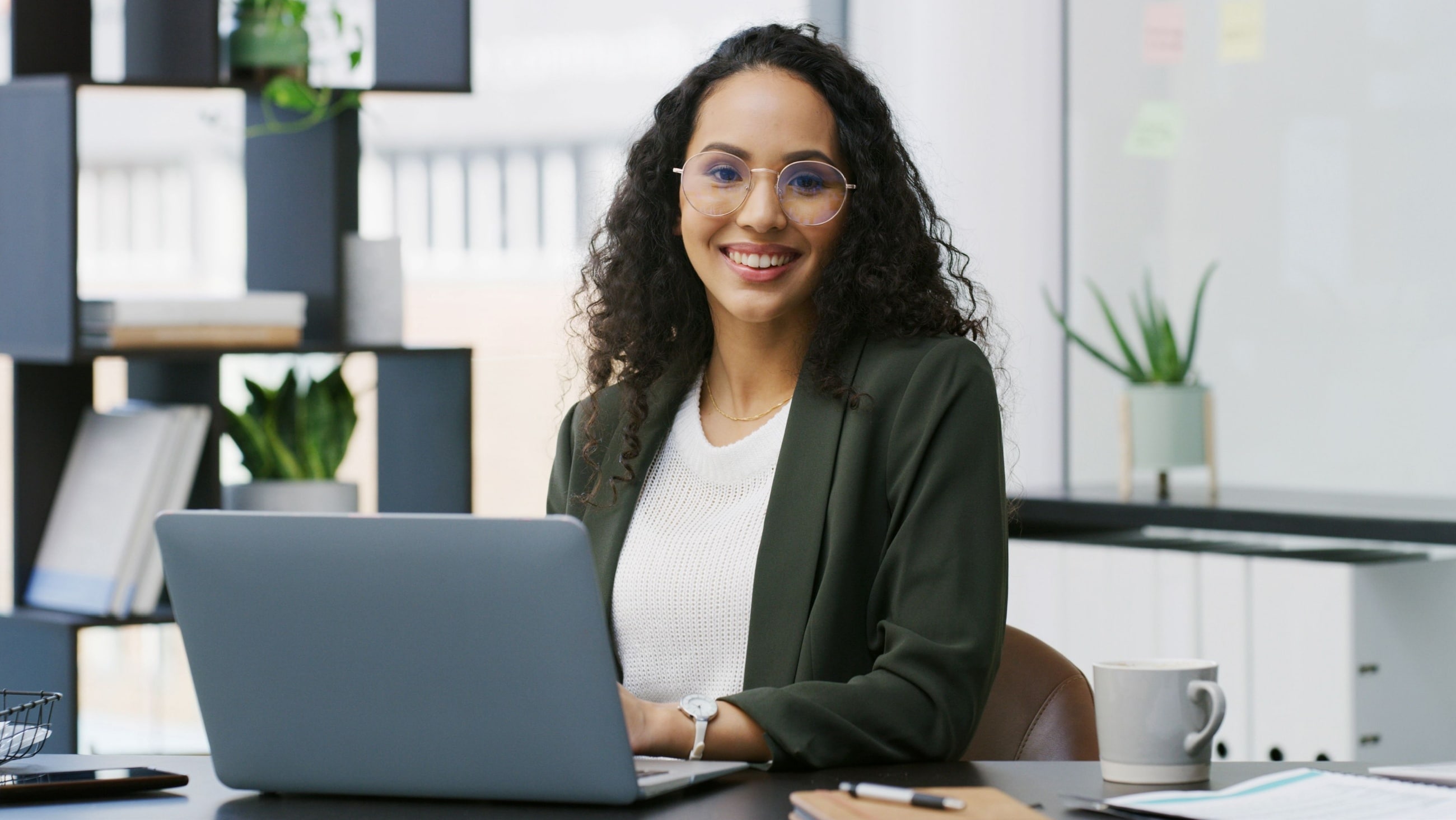 Woman wearing glasses in workplace