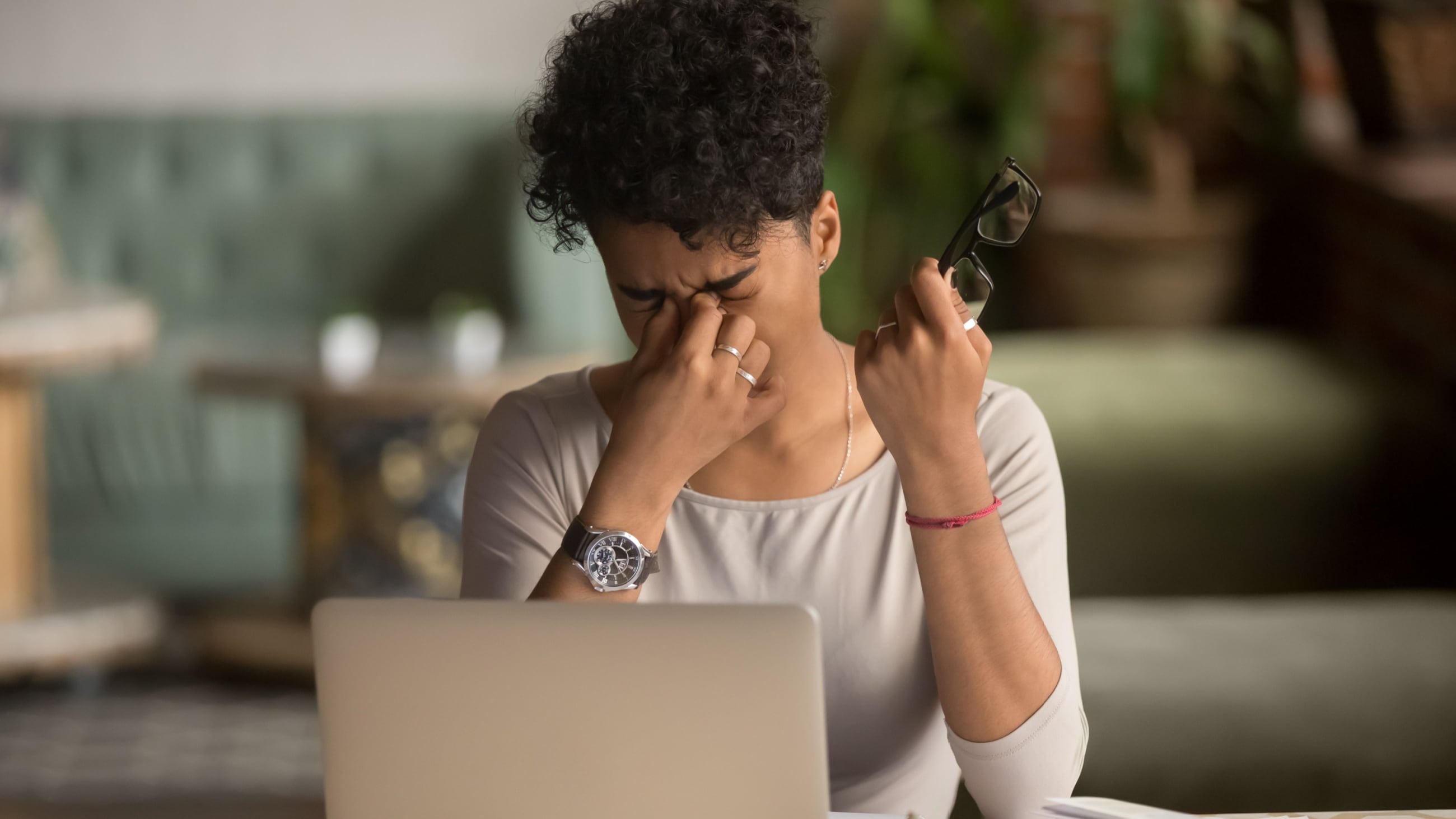 woman at computer with tired eyes