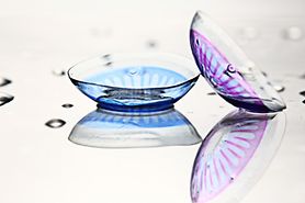 Two colored contact lenses, one for blue eyes and one for purple eyes. Two colored contact lenses, one for blue eyes and one for purple eyes.