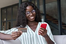 woman buying glasses on frames direct website  on her mobile phone
