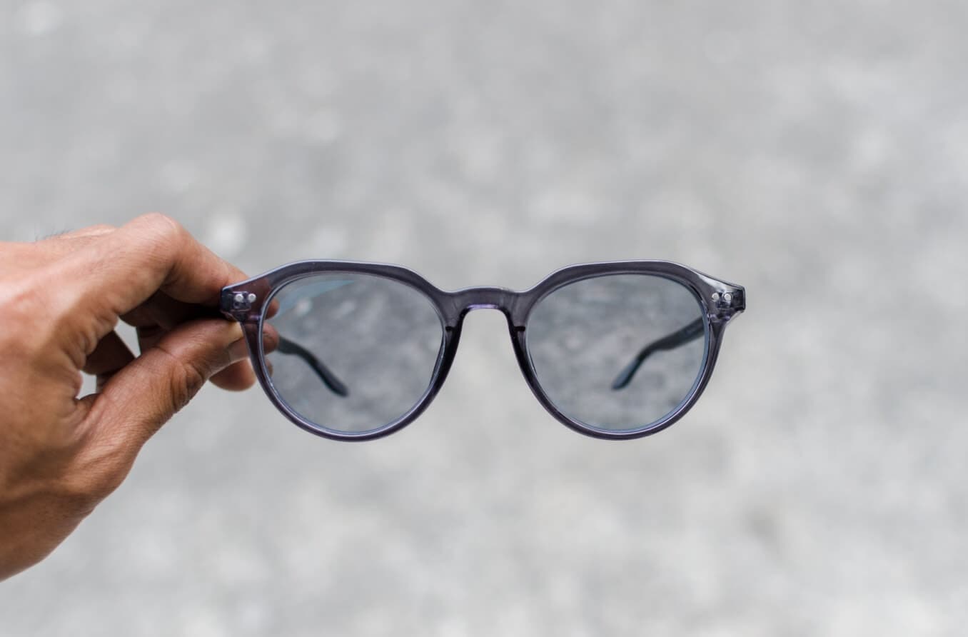 Person holding Transition lenses Person holding Transition lenses