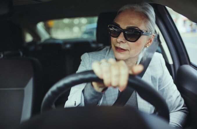 woman in sunglasses driving