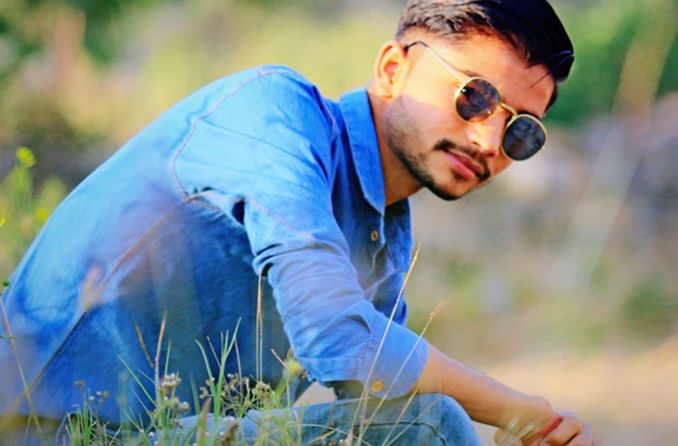 Man wearing prescription sunglasses stares at sunset Man wearing prescription sunglasses stares at sunset