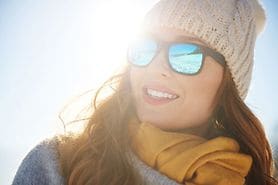 woman wearing sunglasses in the winter